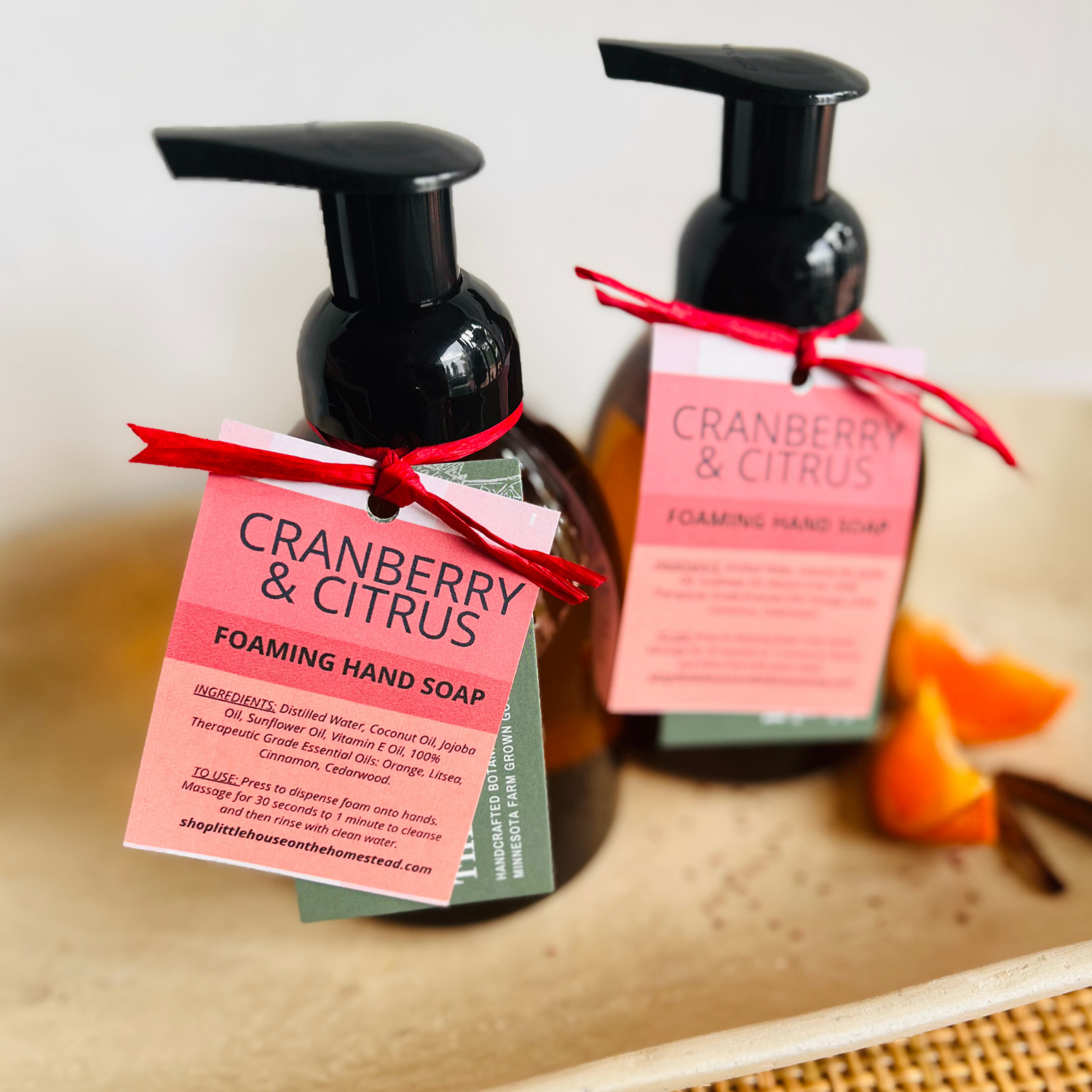Cranberry and Citrus foaming hand soap ingredient tag showing orange, litsea, cinnamon and cedarwood essential oils
